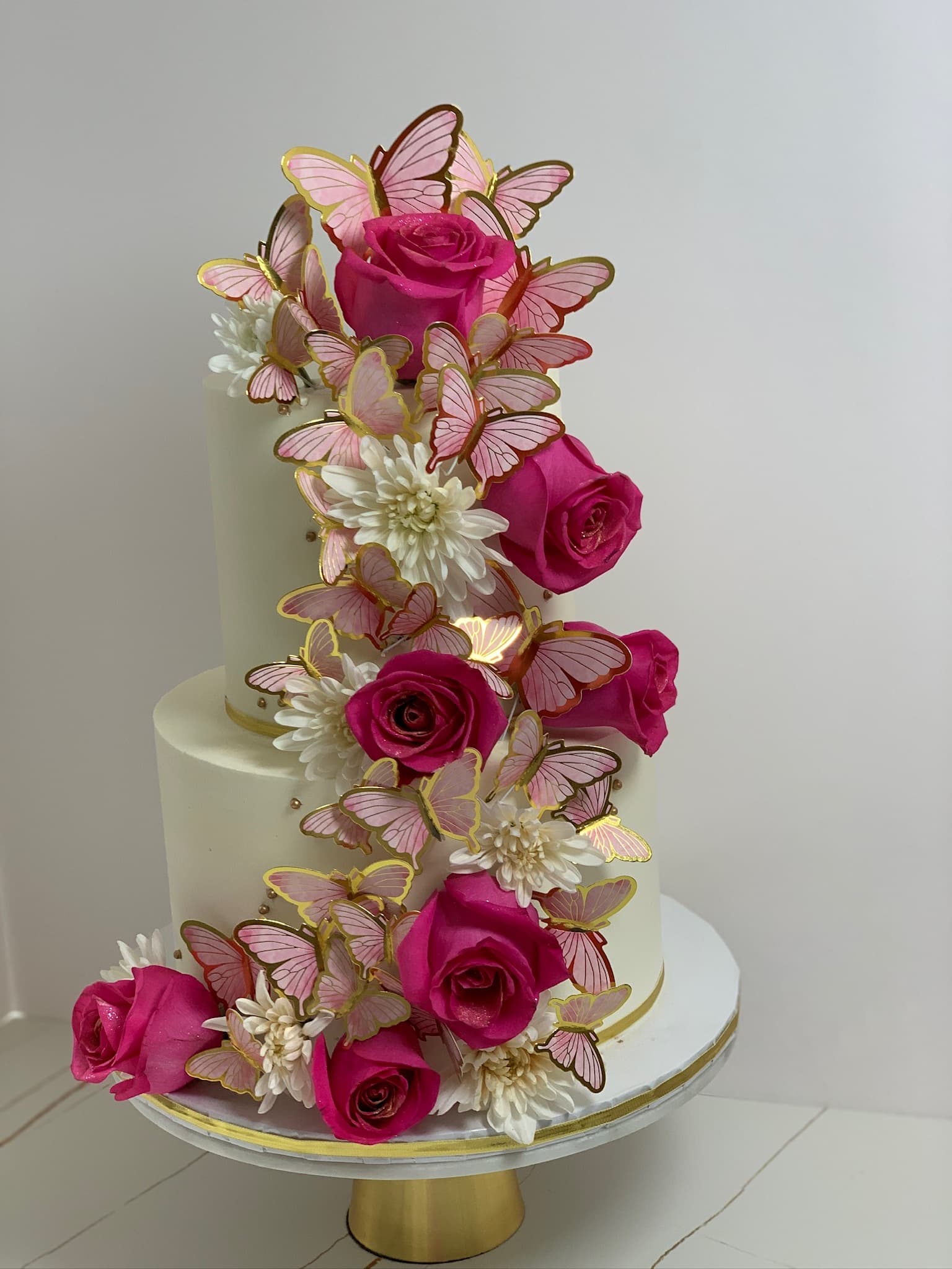 Butterfly and rose two-tier cake — detail view