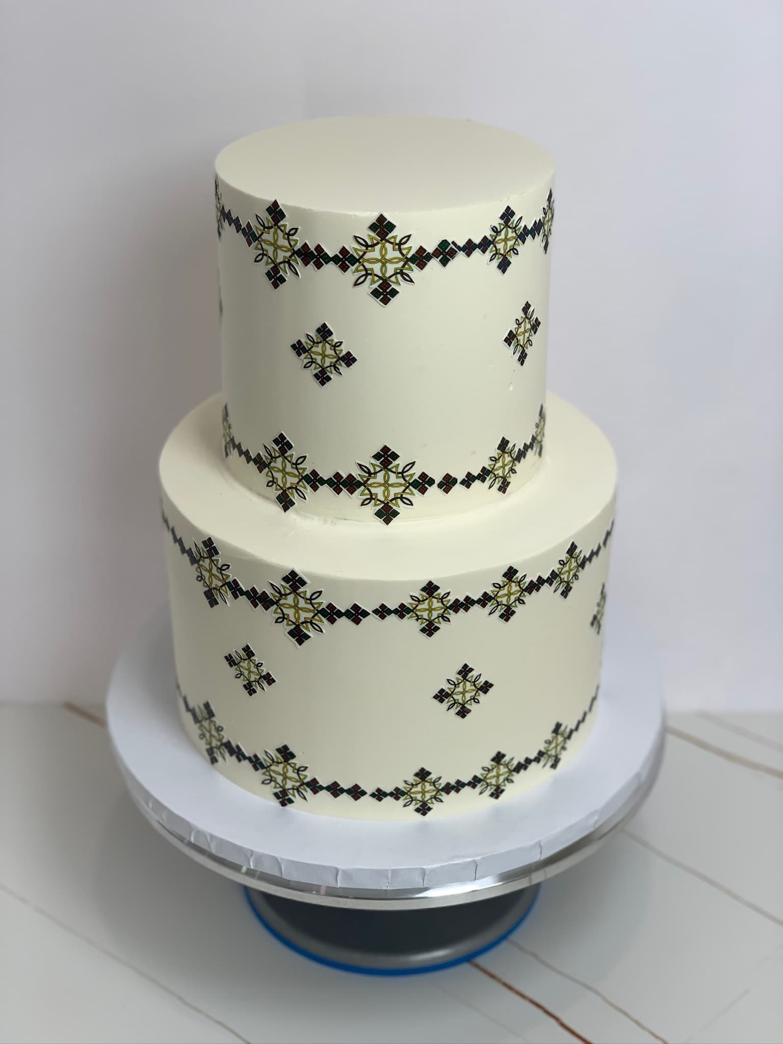 Cross-stitch design two-tier cake