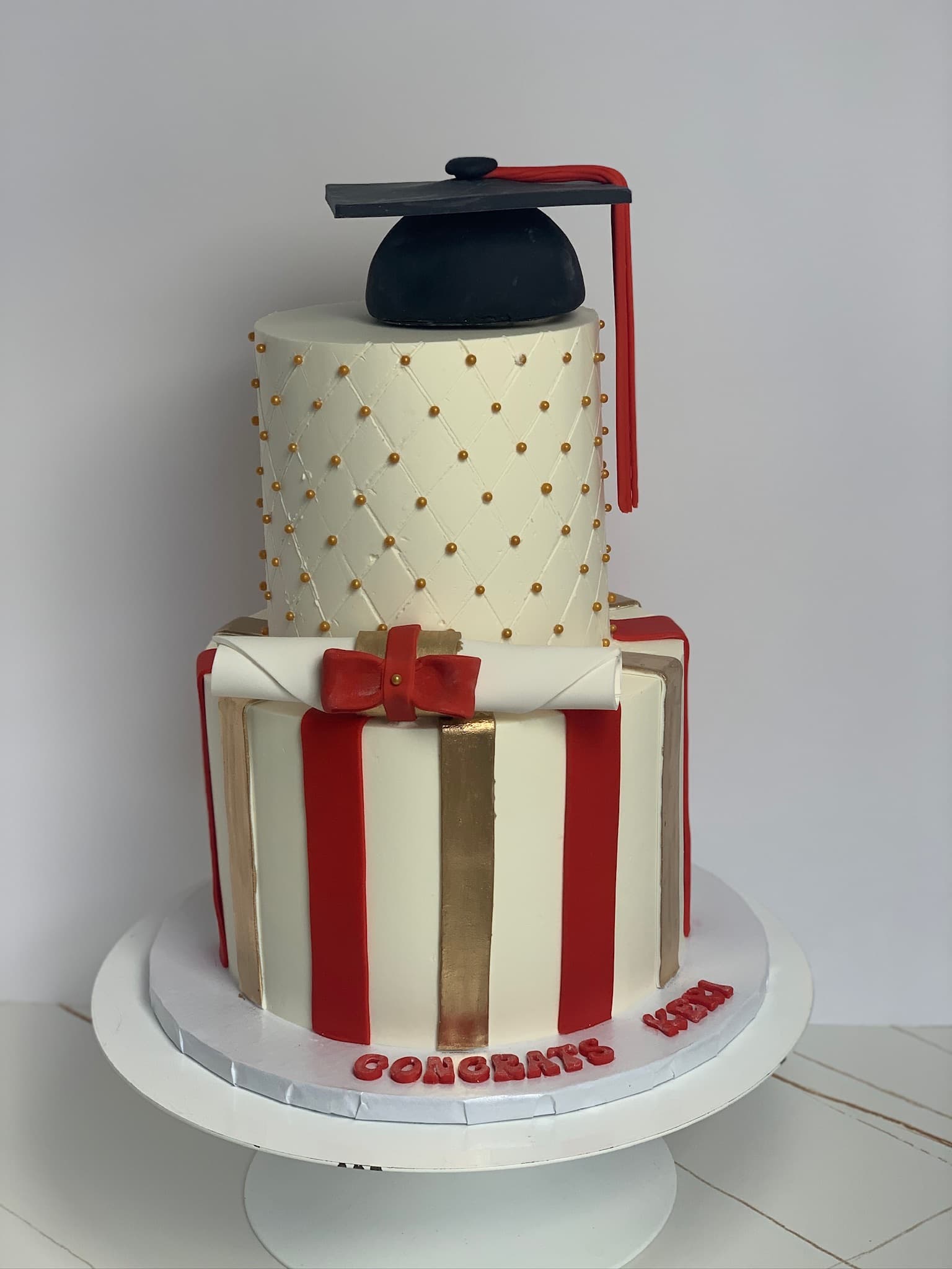 Red and gold quilted graduation cake